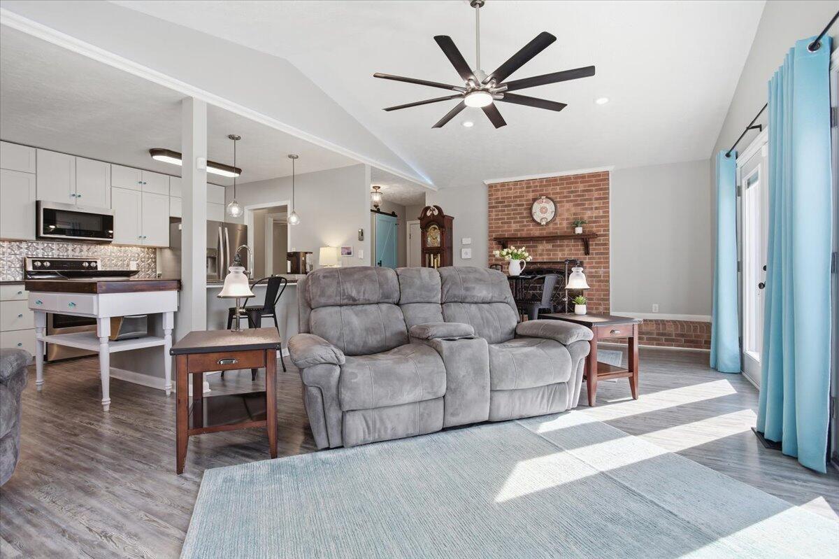 128 Huntington Road Ridgeway, VA 24148 - Photo 17 of 60 a living room with furniture a flat screen tv and kitchen view