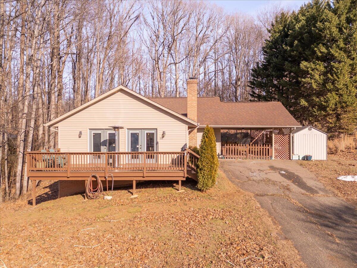 128 Huntington Road Ridgeway, VA 24148 - Photo 2 of 60 a view of a house with a yard covered in snow