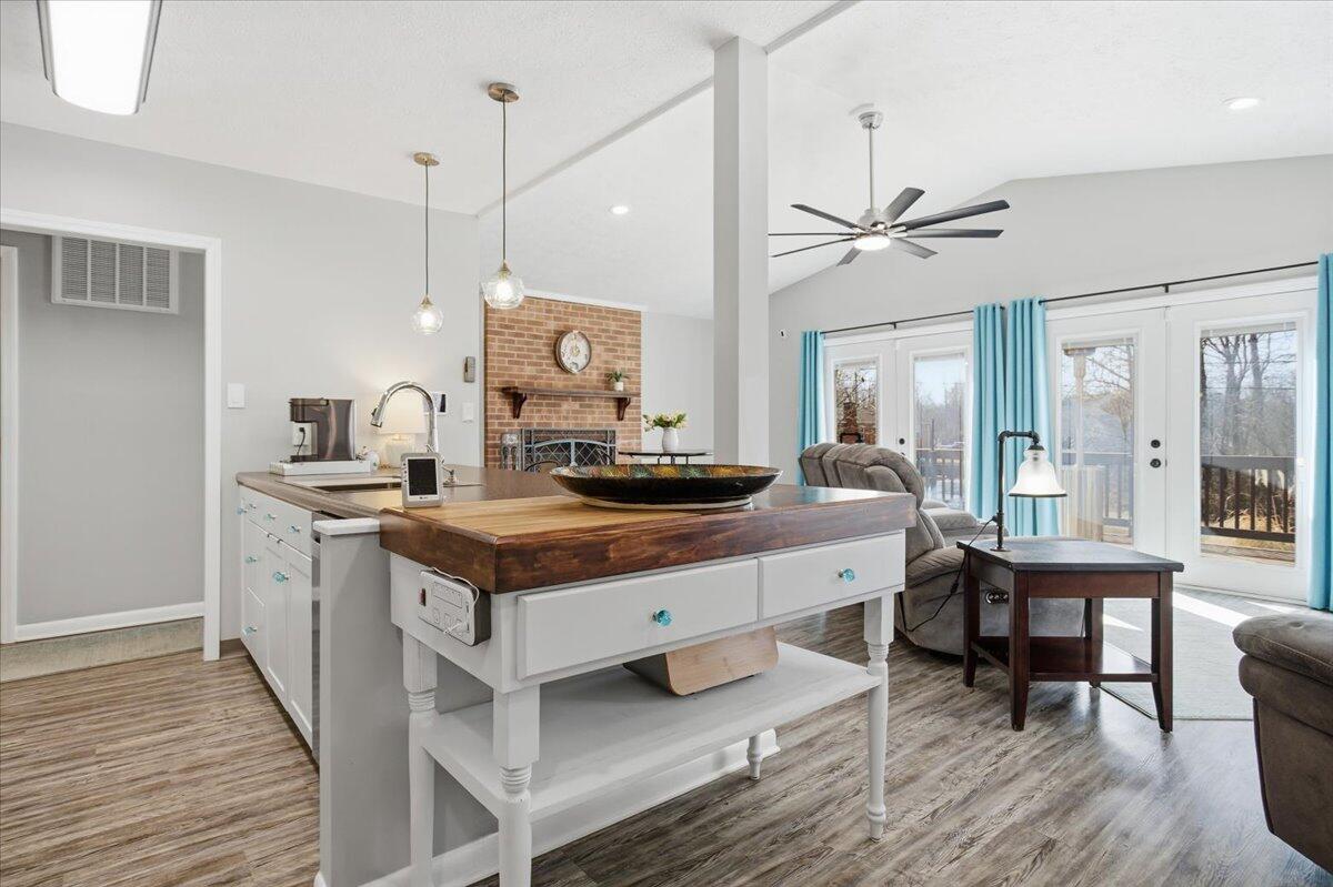 128 Huntington Road Ridgeway, VA 24148 - Photo 21 of 60 a living room with a table chairs and wooden floor
