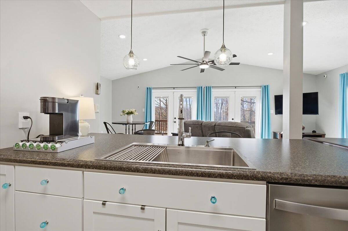 128 Huntington Road Ridgeway, VA 24148 - Photo 25 of 60 a view with granite countertop stainless steel appliances a sink a counter space cabinets and a chandelier