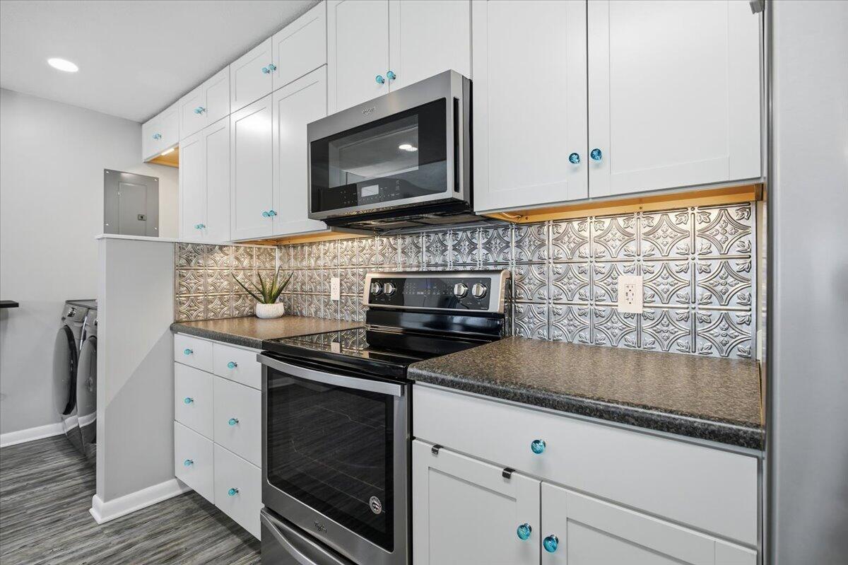 128 Huntington Road Ridgeway, VA 24148 - Photo 26 of 60 a kitchen with granite countertop white cabinets stainless steel appliances and a sink