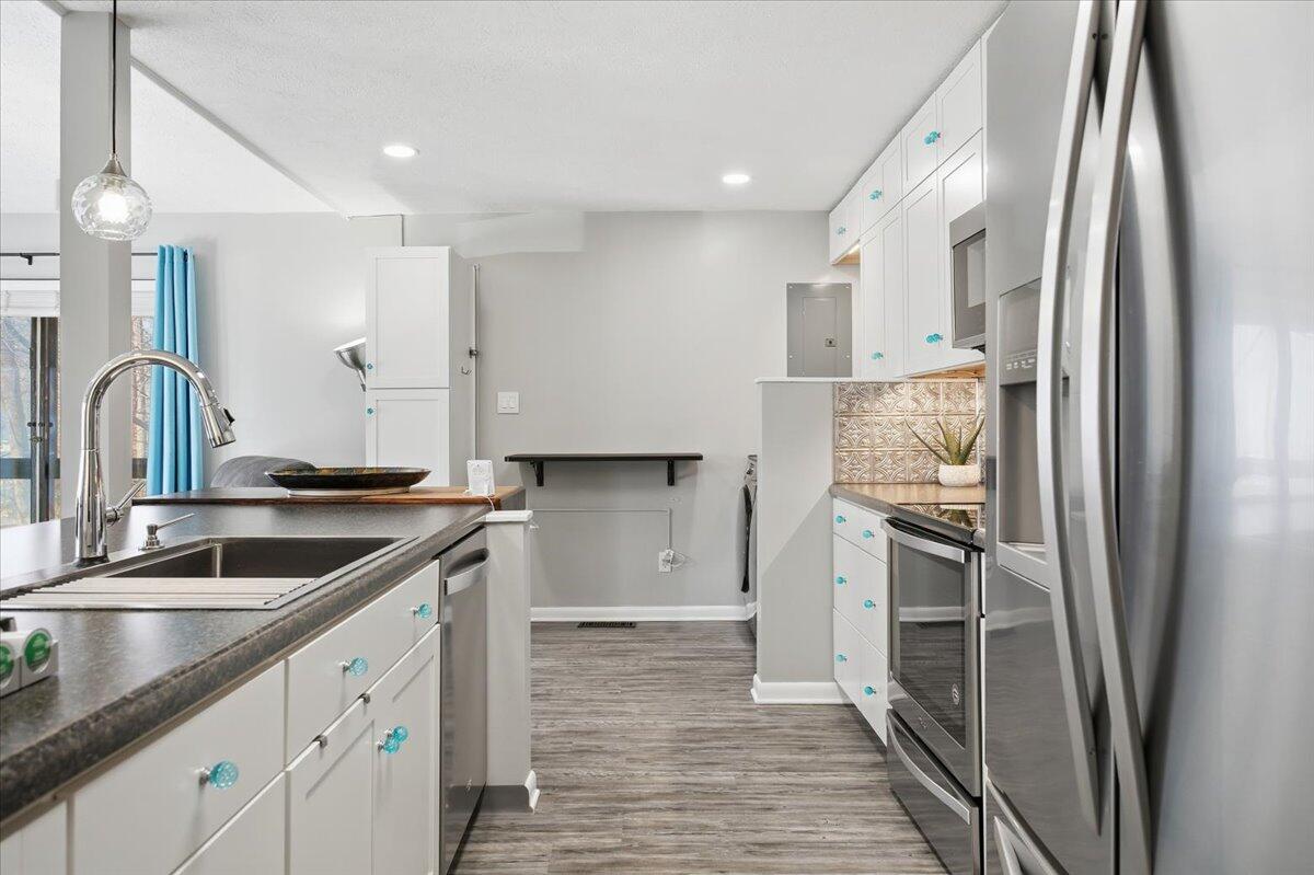 128 Huntington Road Ridgeway, VA 24148 - Photo 27 of 60 a kitchen with a sink and refrigerator