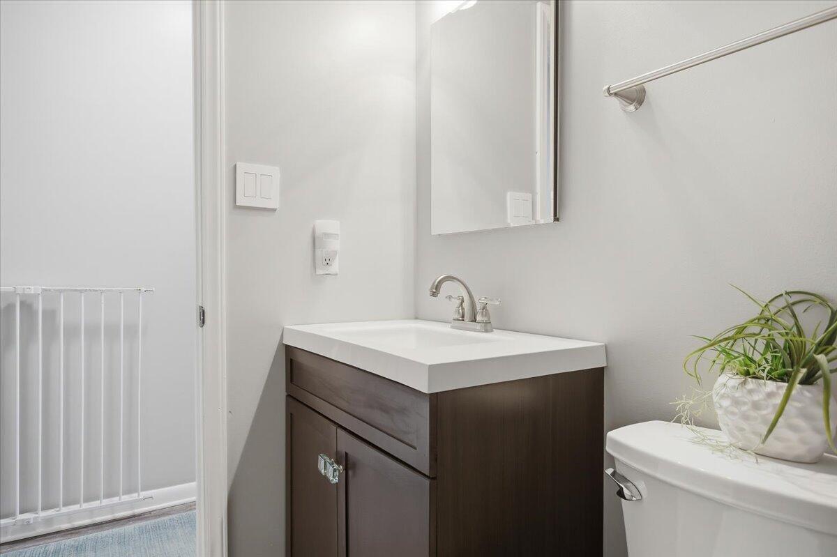 128 Huntington Road Ridgeway, VA 24148 - Photo 32 of 60 a bathroom with a sink toilet and vanity