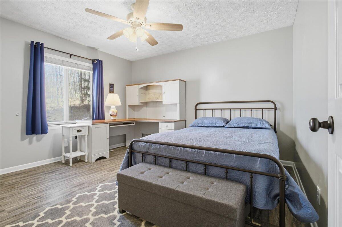 128 Huntington Road Ridgeway, VA 24148 - Photo 33 of 60 a bedroom with a bed and window