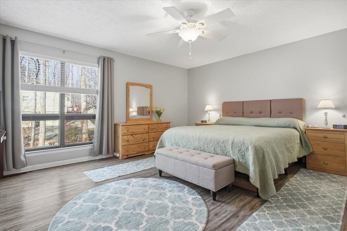 128 Huntington Road Ridgeway, VA 24148 - Photo 35 of 60 a spacious bedroom with a large bed and a large window