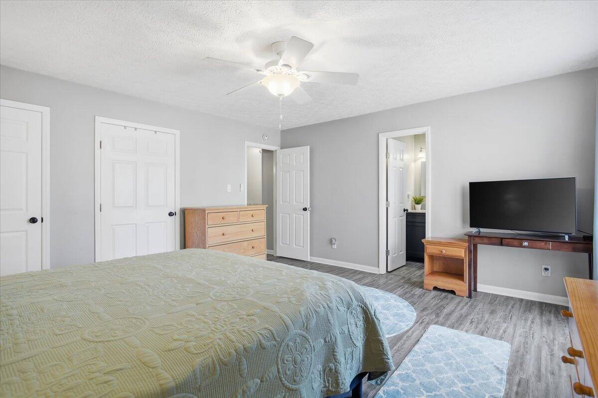 128 Huntington Road Ridgeway, VA 24148 - Photo 37 of 60 a bedroom with a bed and a flat screen tv