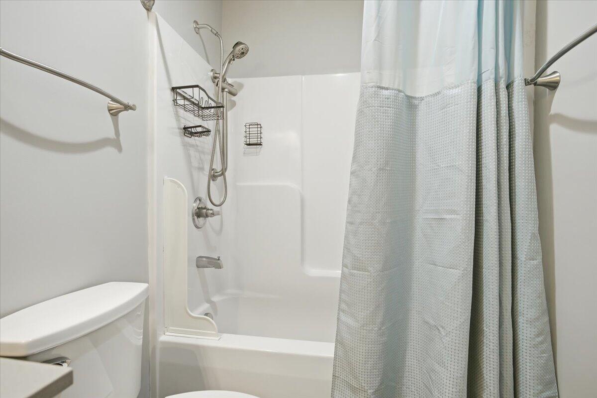 128 Huntington Road Ridgeway, VA 24148 - Photo 39 of 60 a bathroom with a granite countertop shower a toilet and a sink