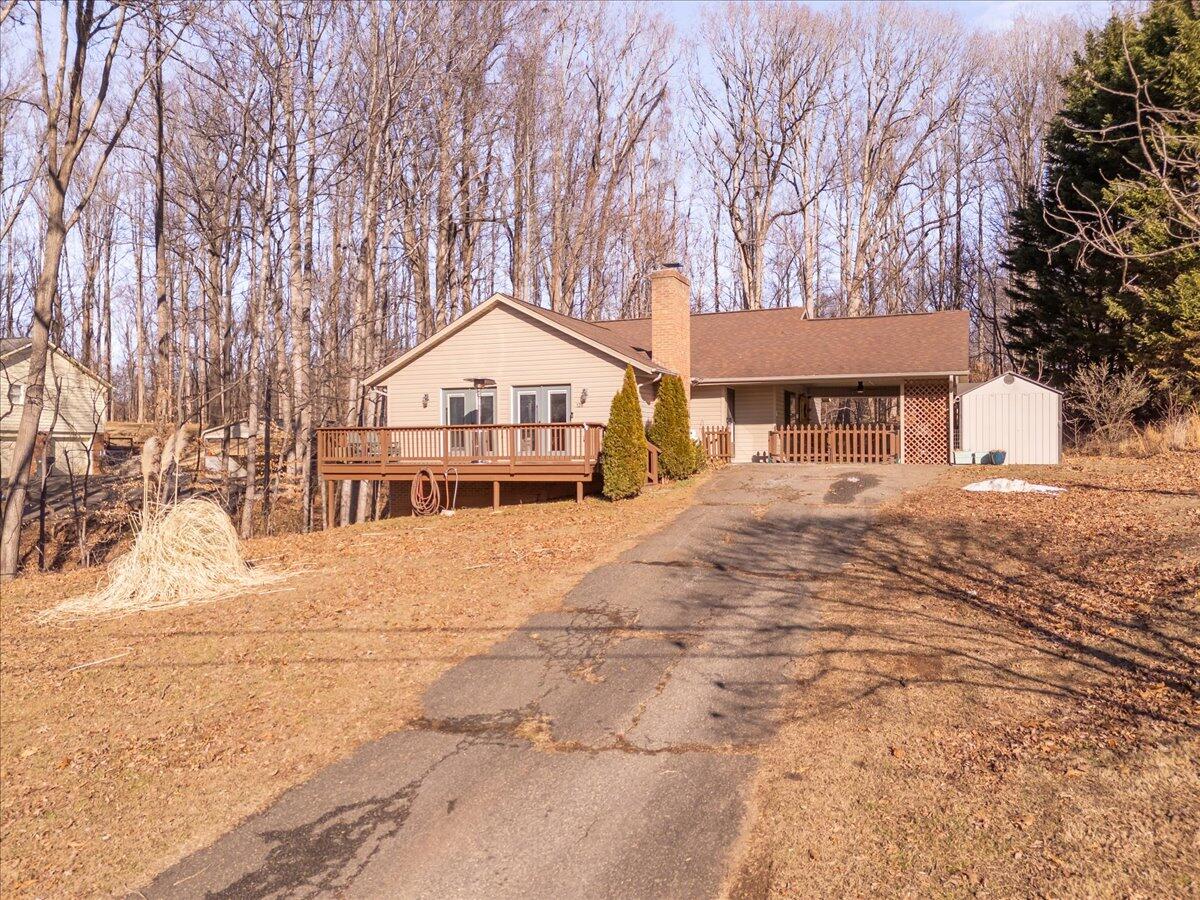 128 Huntington Road Ridgeway, VA 24148 - Photo 4 of 60 a front view of a house with a yard covered with snow