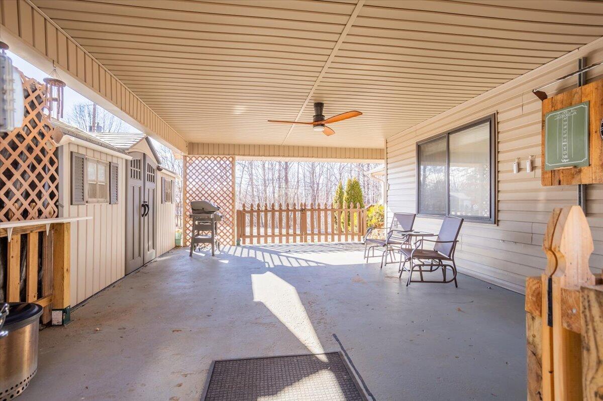128 Huntington Road Ridgeway, VA 24148 - Photo 44 of 60 a view of a patio with table and chairs and wooden floor