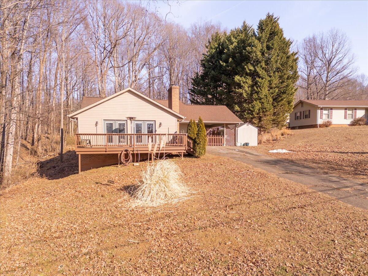 128 Huntington Road Ridgeway, VA 24148 - Photo 5 of 60 a front view of a house with a yard covered in snow