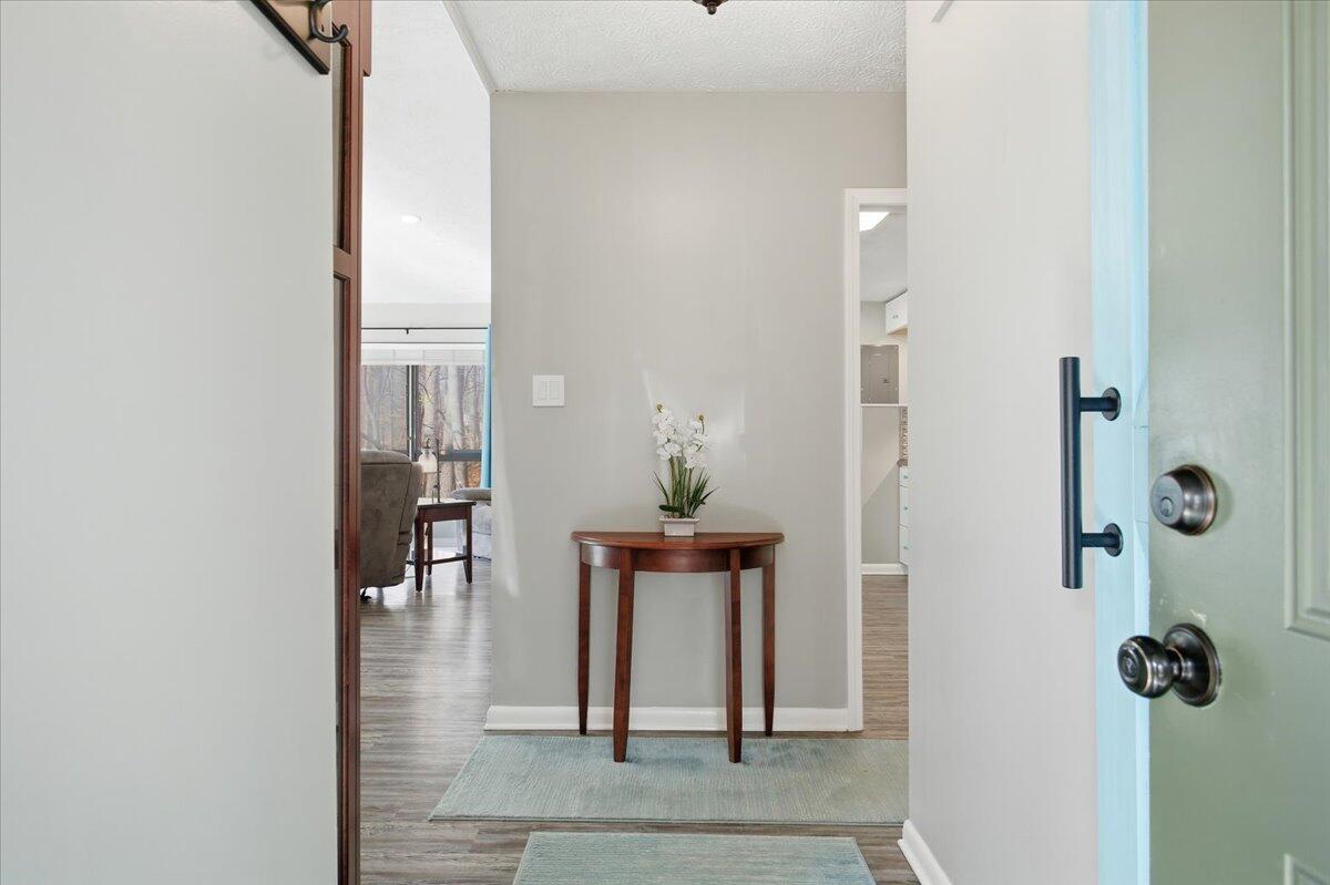128 Huntington Road Ridgeway, VA 24148 - Photo 9 of 60 a view of a hallway with dining room and wooden floor