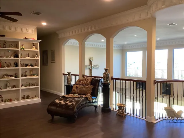 a bedroom with a bed and a book shelf