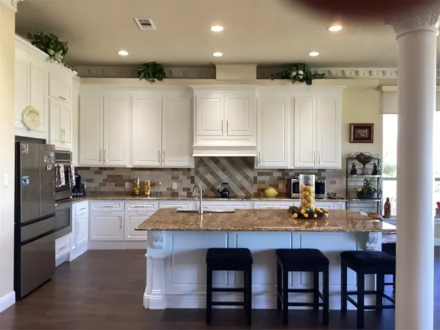 a living room with furniture and a mirror