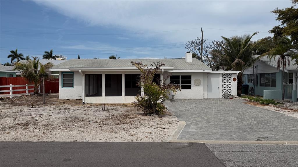 114 78th Street Holmes Beach, FL 34217 - Photo 13 of 25 front view of a house with a porch