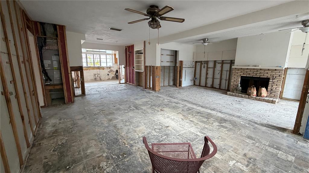 114 78th Street Holmes Beach, FL 34217 - Photo 16 of 25 a view of a livingroom with a fireplace window and wooden floor