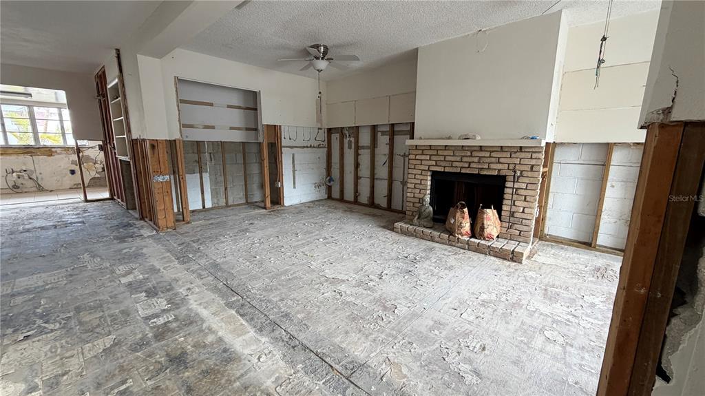 114 78th Street Holmes Beach, FL 34217 - Photo 17 of 25 a view of a livingroom with a fireplace