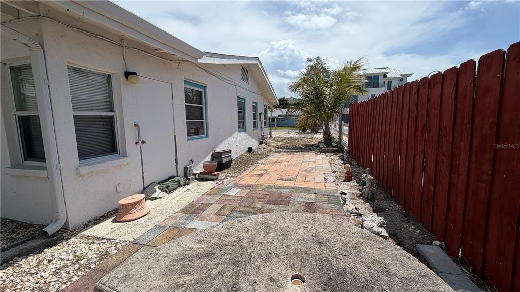 114 78th Street Holmes Beach, FL 34217 - Photo 25 of 25 a view of a backyard of the house