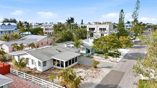 an aerial view of residential houses with outdoor space