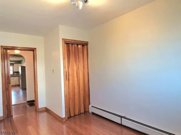 an empty room with wooden floor