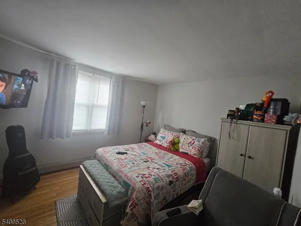 a kitchen with granite countertop a stove a sink and a microwave