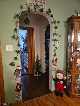 a view of a dining room with furniture and chandelier