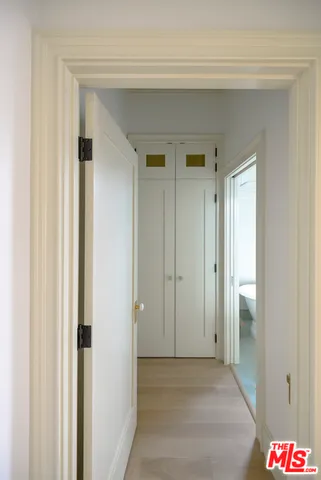 a view of an empty room and a window