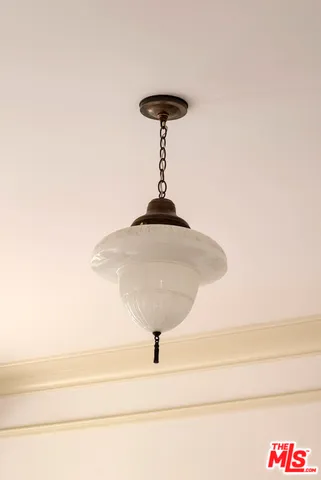 a view of a house with a small yard and plants