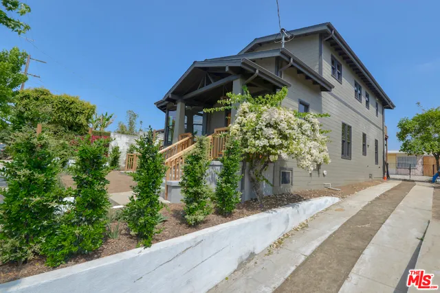 an aerial view of a house with a swimming pool