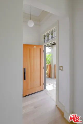 a view of an empty room and a window