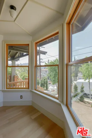 a view of an empty room and a window