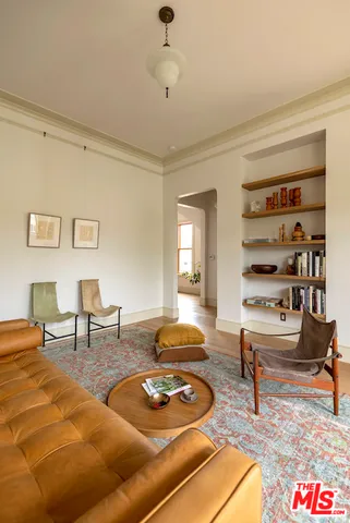 a living room with furniture and a rug
