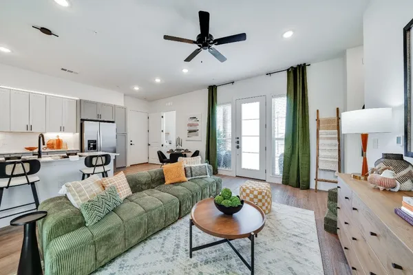 a living room with furniture or couch and a view of kitchen