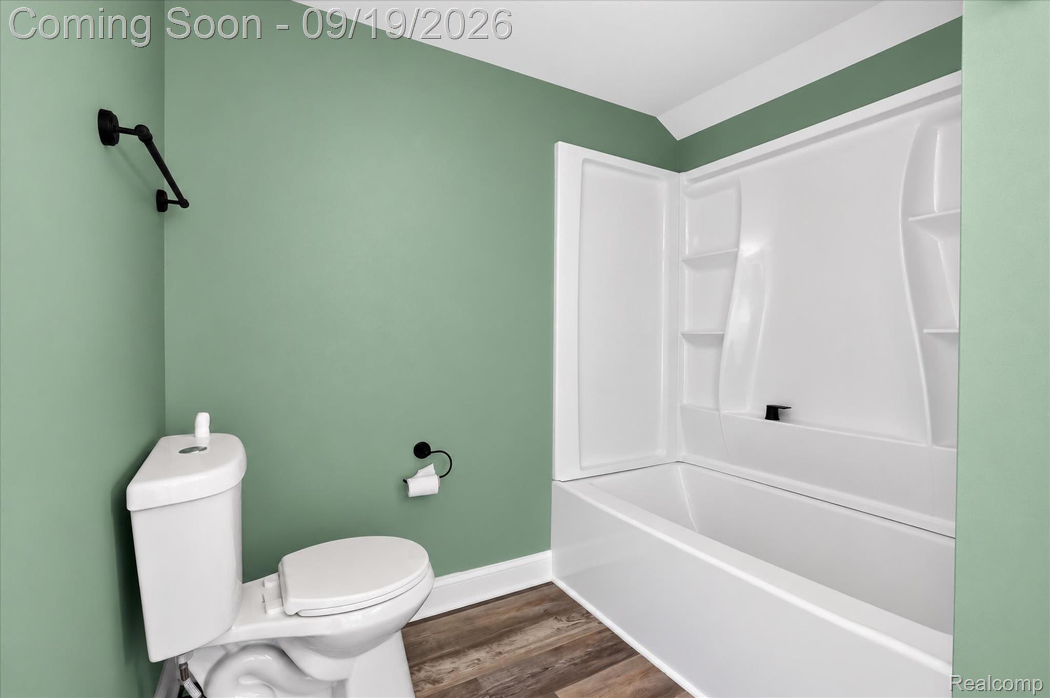 10215 West Mount Morris Road Flushing, MI 48433 - Photo 31 of 58 Full bath featuring a tub/shower combination, white toilet, and wood-finish flooring