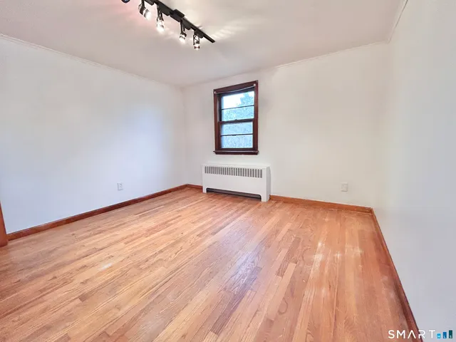 a view of a bathroom with a tub and door