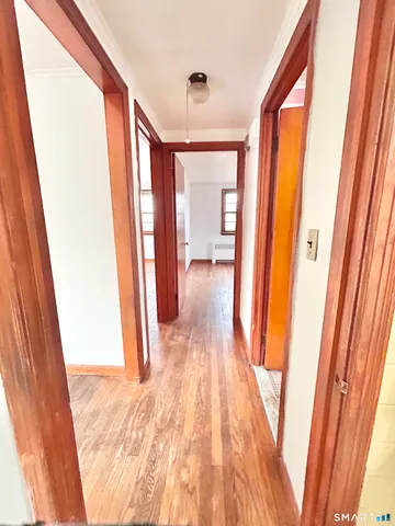 a bathroom with a sink a toilet a mirror and shower