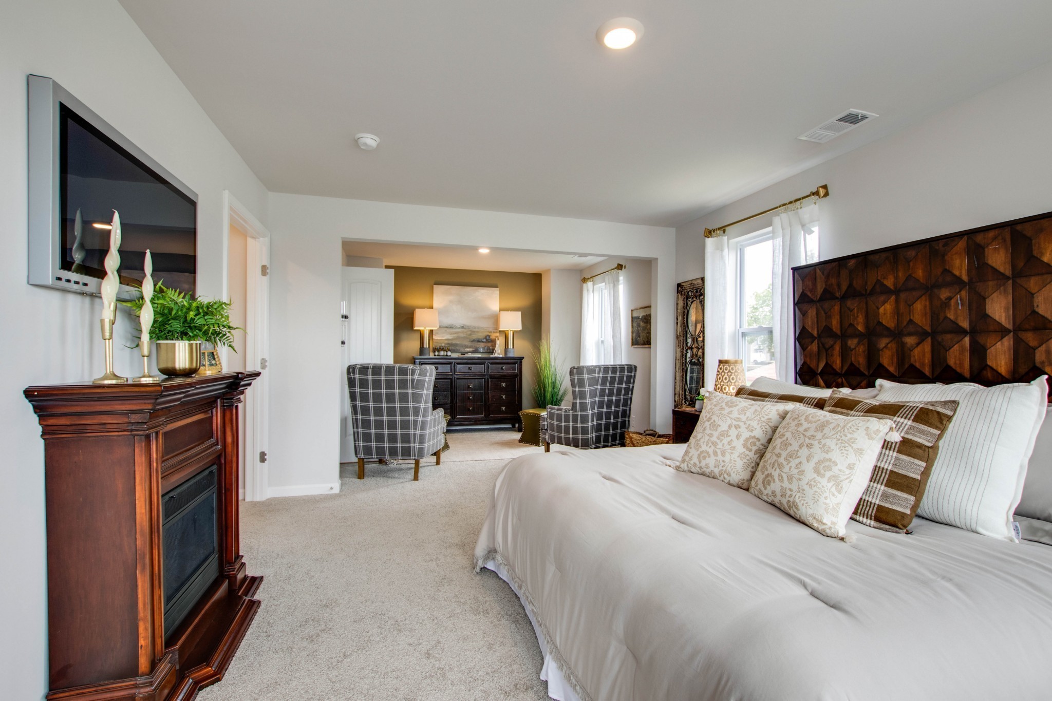 258 Hazel Lane Lebanon, TN 37087 - Photo 16 of 37 a bedroom with a large bed and a couch