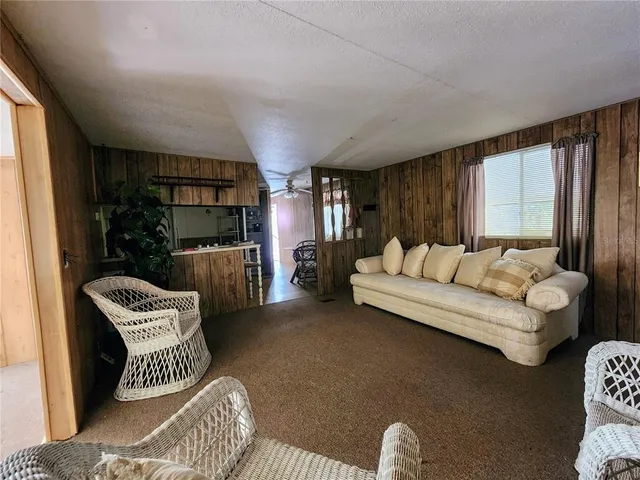 a kitchen with stainless steel appliances granite countertop wooden cabinets a stove top oven a sink and dishwasher