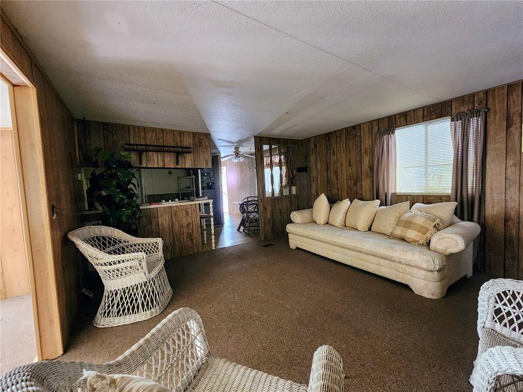 13022 East Shawnee Trail Inverness, FL 34450 - Photo 11 of 80 a bedroom with furniture and a large window