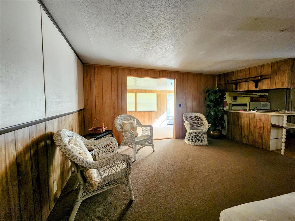 13022 East Shawnee Trail Inverness, FL 34450 - Photo 12 of 80 a living room with furniture and a window