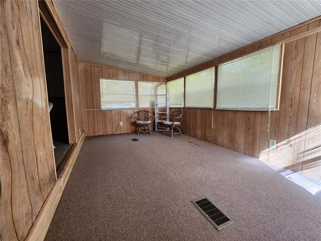 a kitchen with stainless steel appliances kitchen island granite countertop a refrigerator and a stove top oven