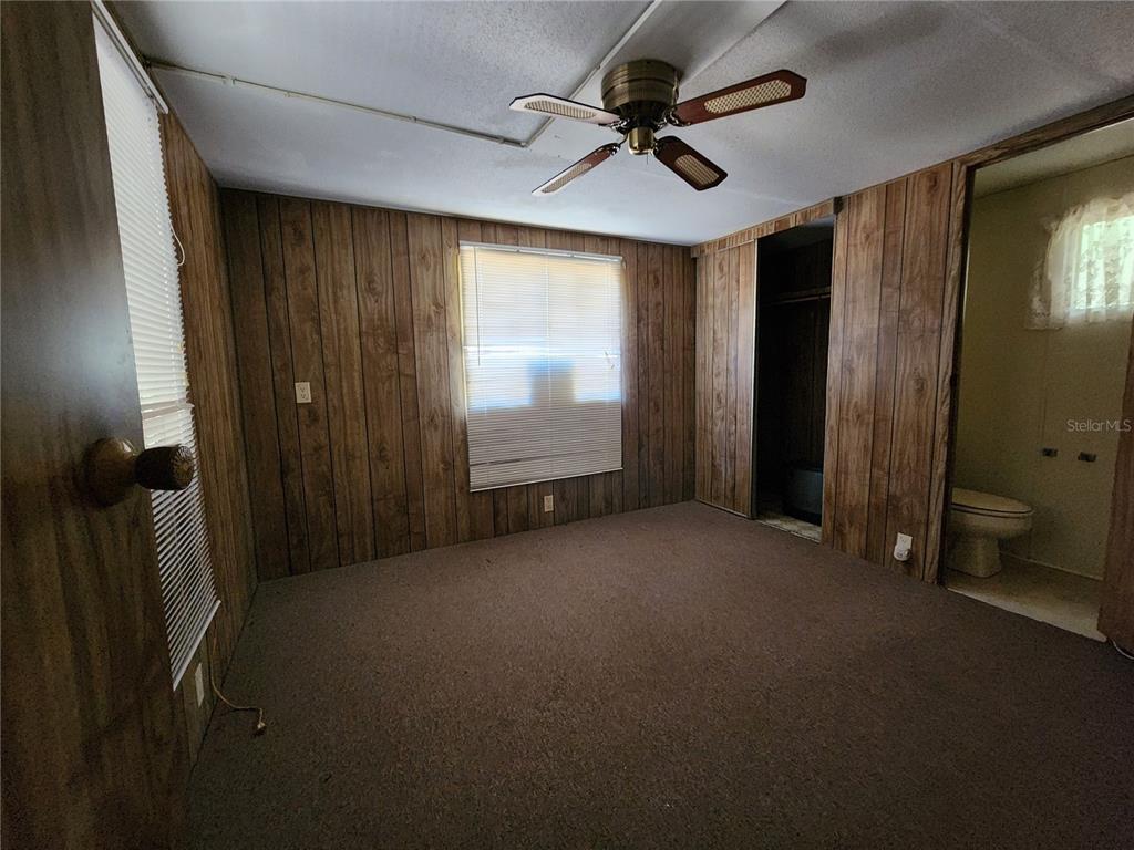 13022 East Shawnee Trail Inverness, FL 34450 - Photo 23 of 80 a view of a livingroom with a ceiling fan and window