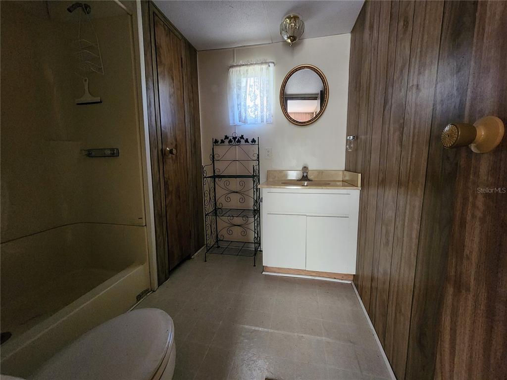 13022 East Shawnee Trail Inverness, FL 34450 - Photo 24 of 80 a bathroom with a toilet a sink and a shower