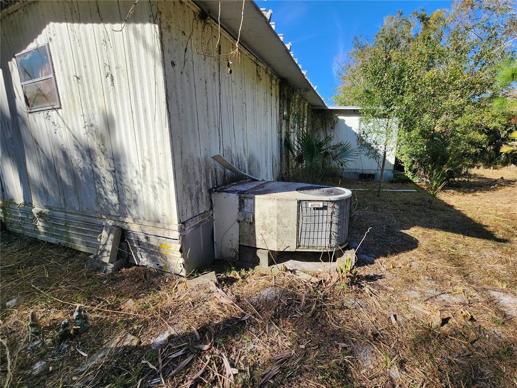13022 East Shawnee Trail Inverness, FL 34450 - Photo 67 of 80 a view of a house with a yard and large tree