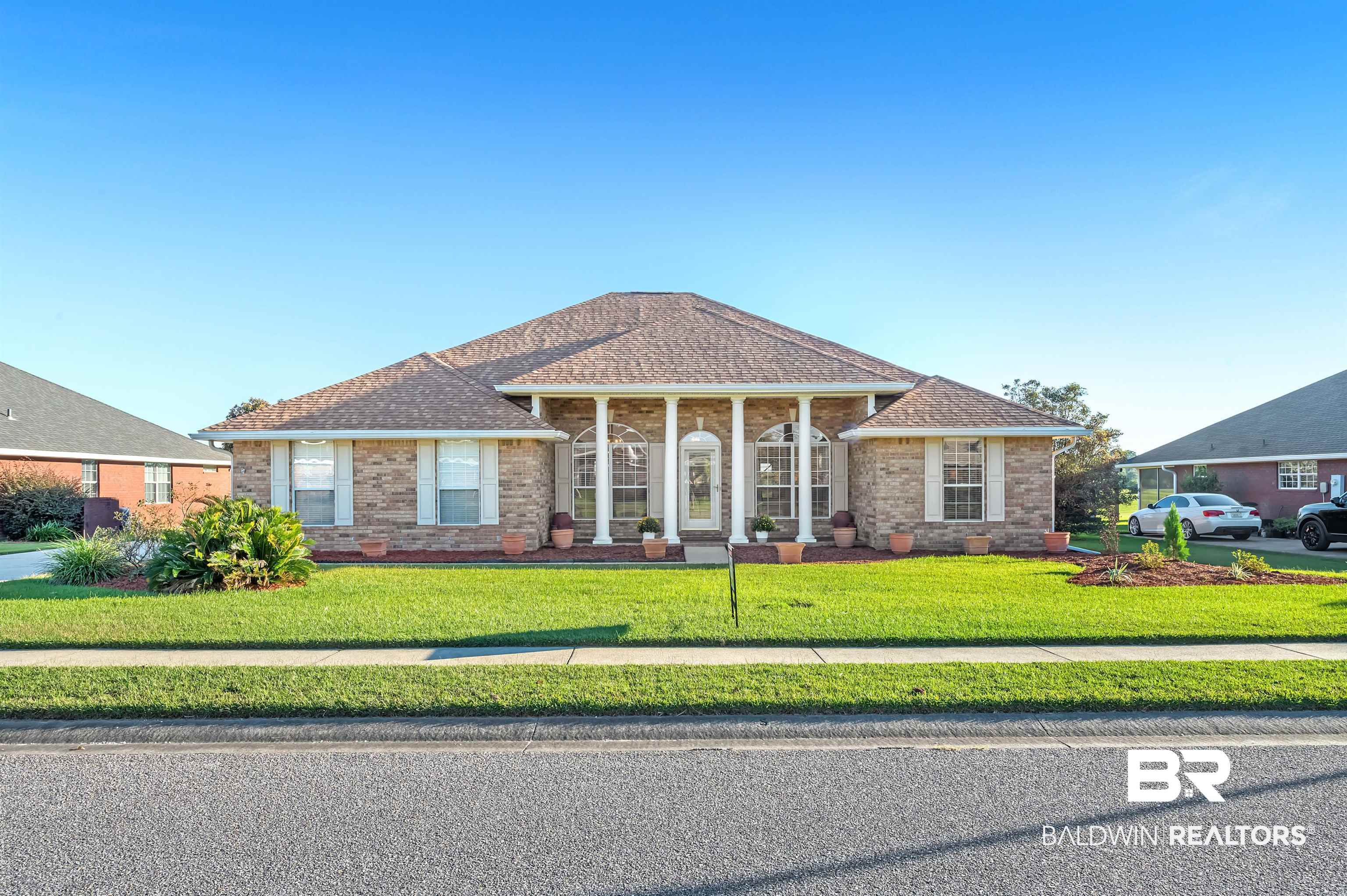 421 Collinwood Loop Foley, AL 36535 - Photo 1 of 62 View of front facade with a front lawn