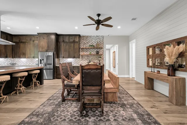 a view of a dining room with furniture window and wooden floor