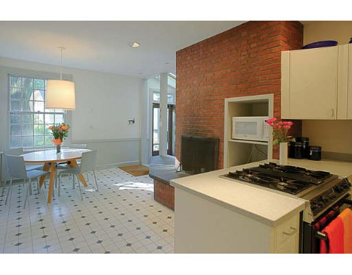 11 Welch Road Brookline, MA 02445 - Photo 6 of 14 a kitchen with a table and chairs in it