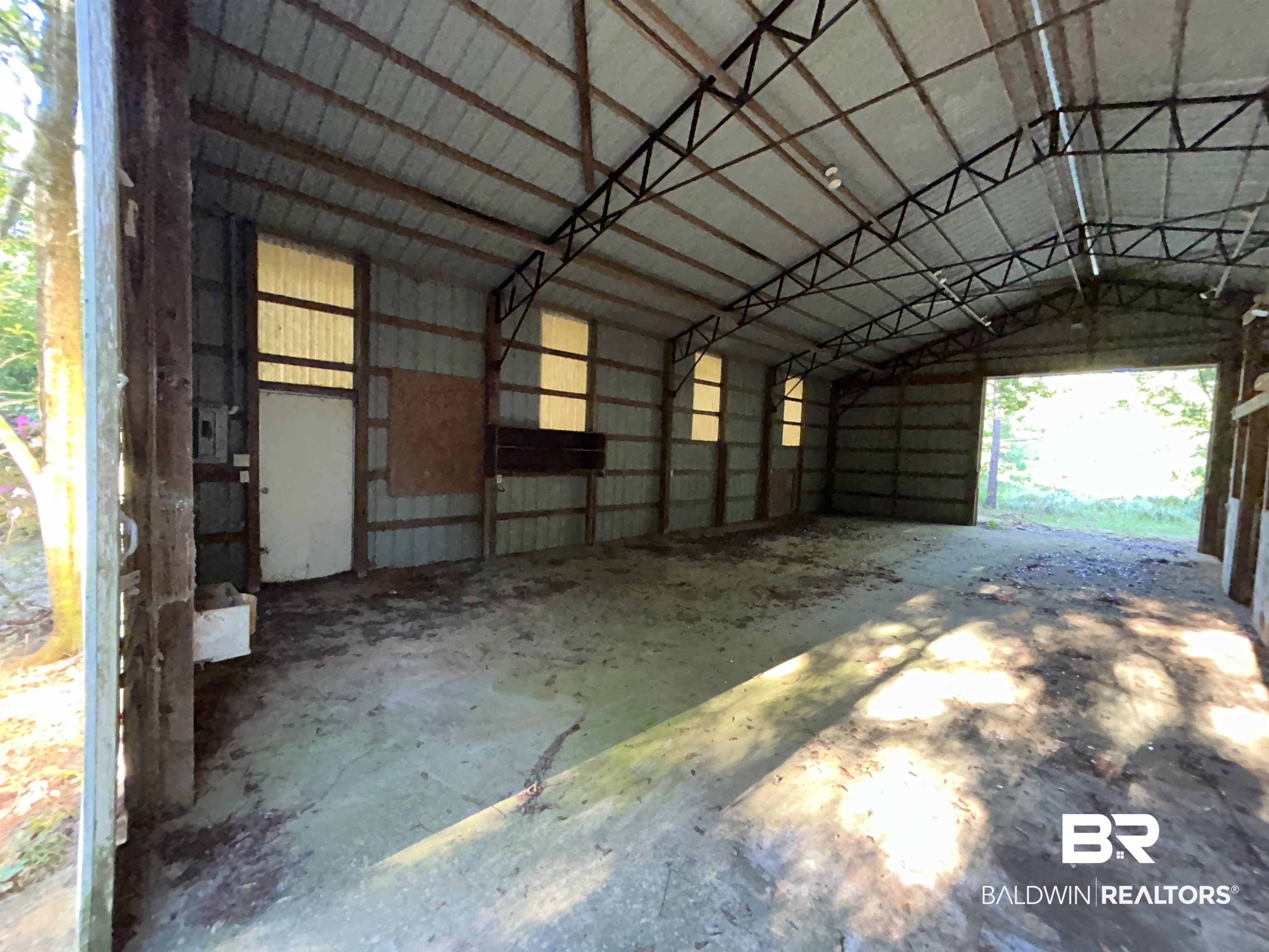 16775 Old Pierce Road Fairhope, AL 36532 - Photo 4 of 4 Garage featuring metal wall