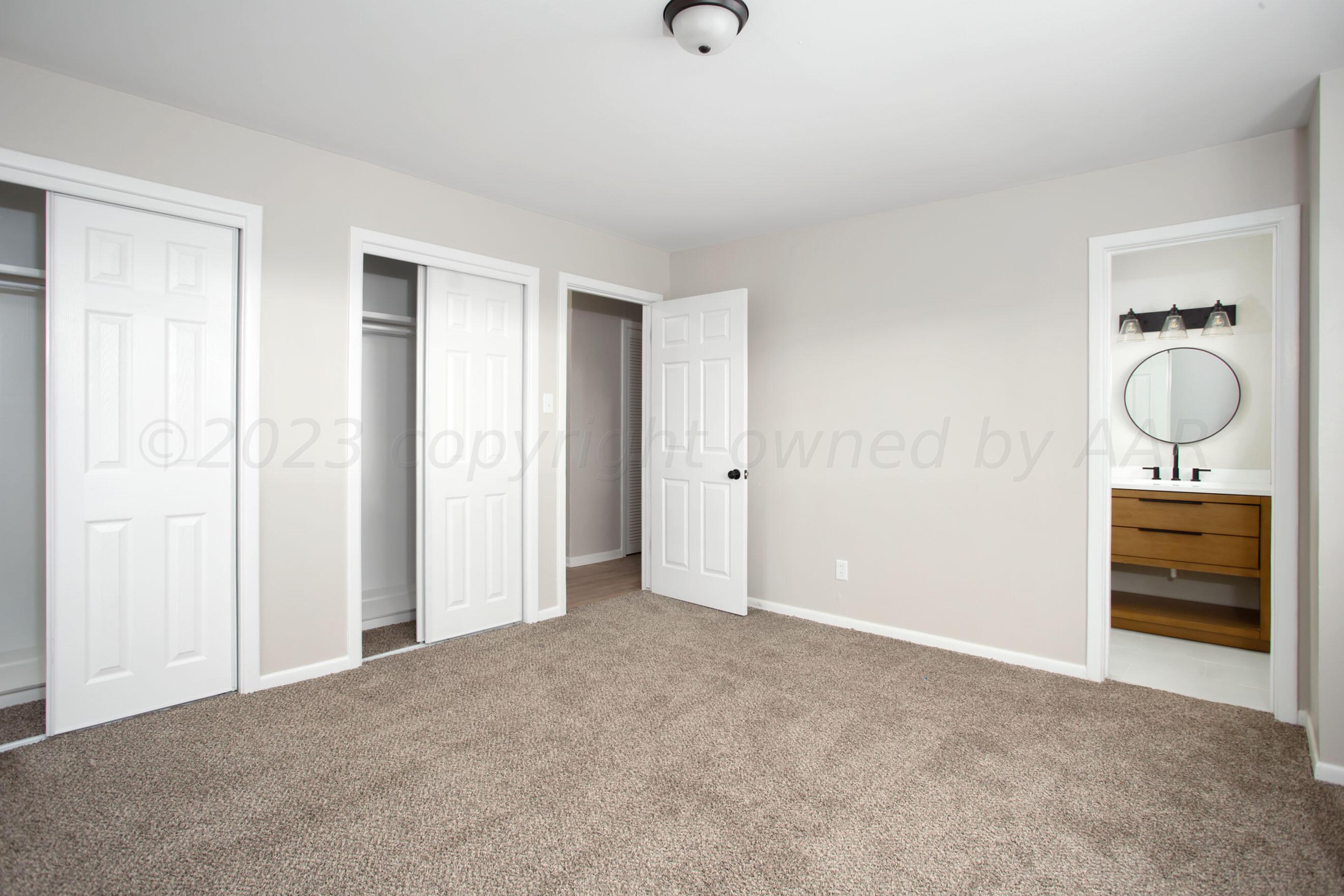 3624 Sunlite Street Amarillo, TX 79109 - Photo 14 of 25 wooden floor and windows in a room