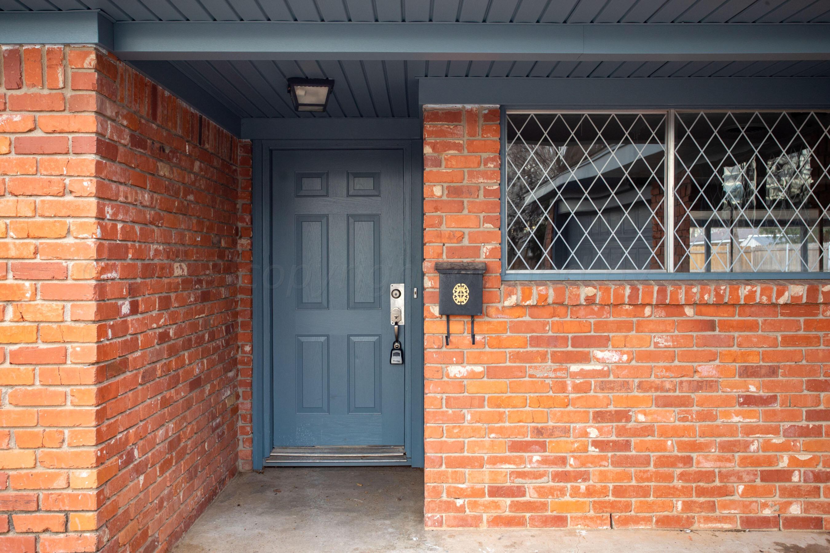 3624 Sunlite Street Amarillo, TX 79109 - Photo 2 of 25 a door view with a brick wall