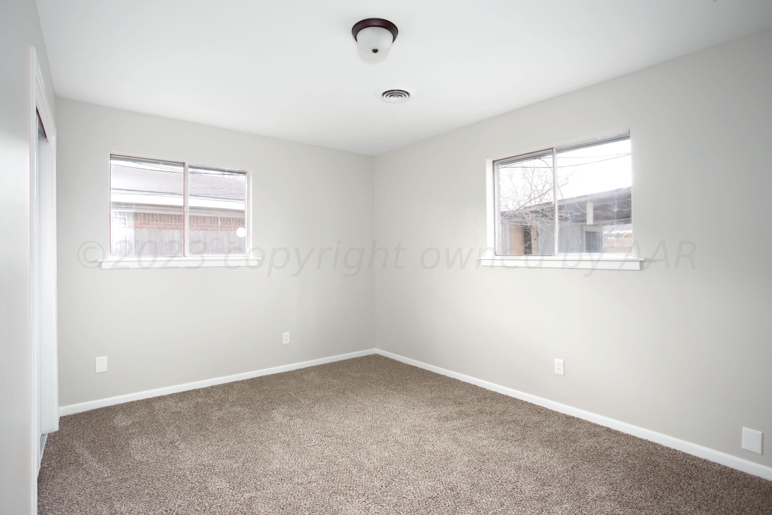 3624 Sunlite Street Amarillo, TX 79109 - Photo 21 of 25 an empty room with a window